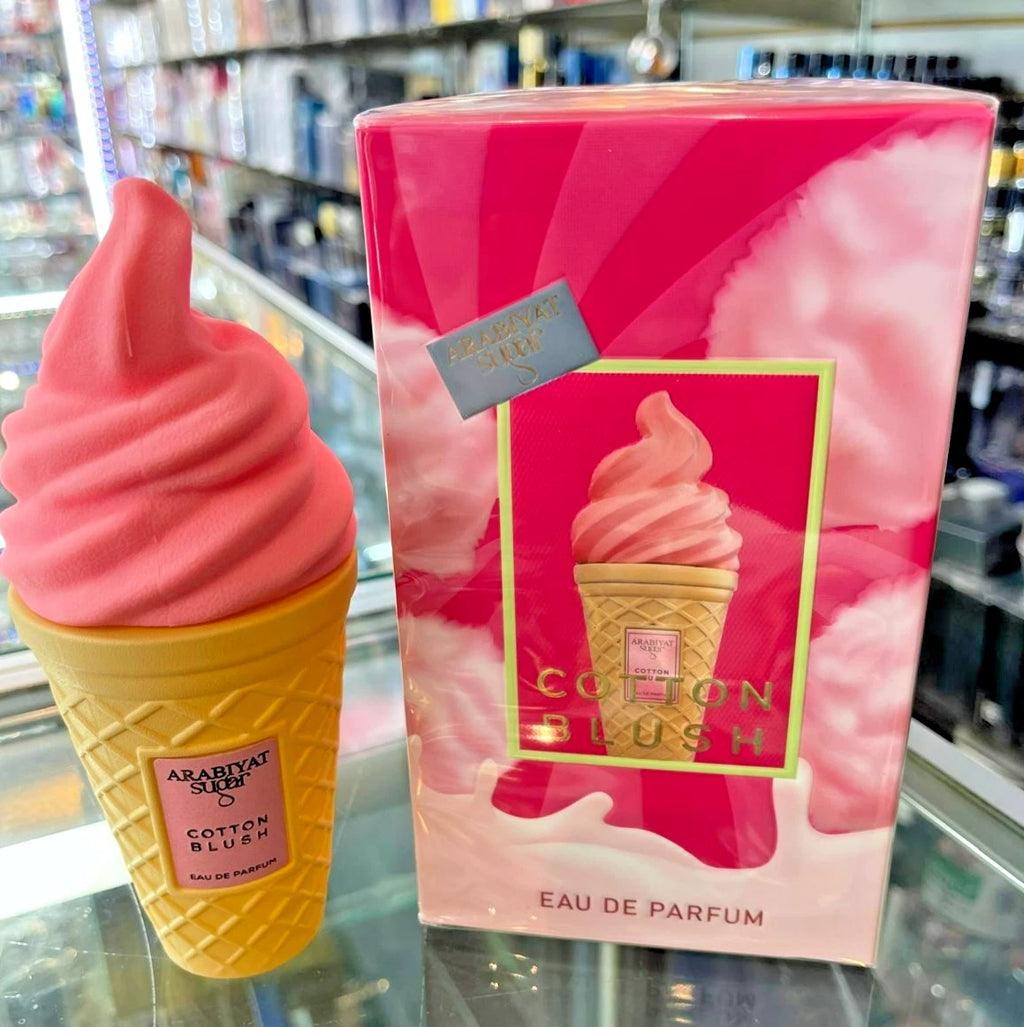 Cotton candy-themed perfume bottle and packaging in a store setting