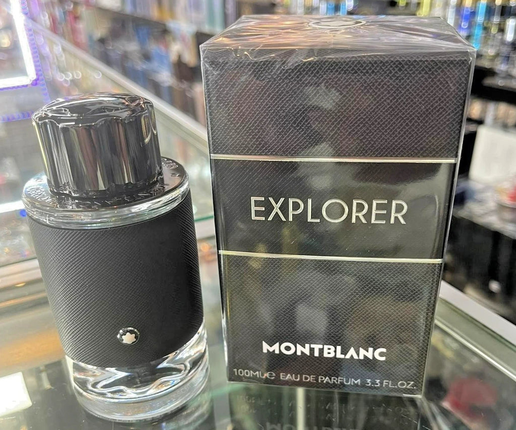 Montblanc Explorer perfume bottle and packaging on a glass surface